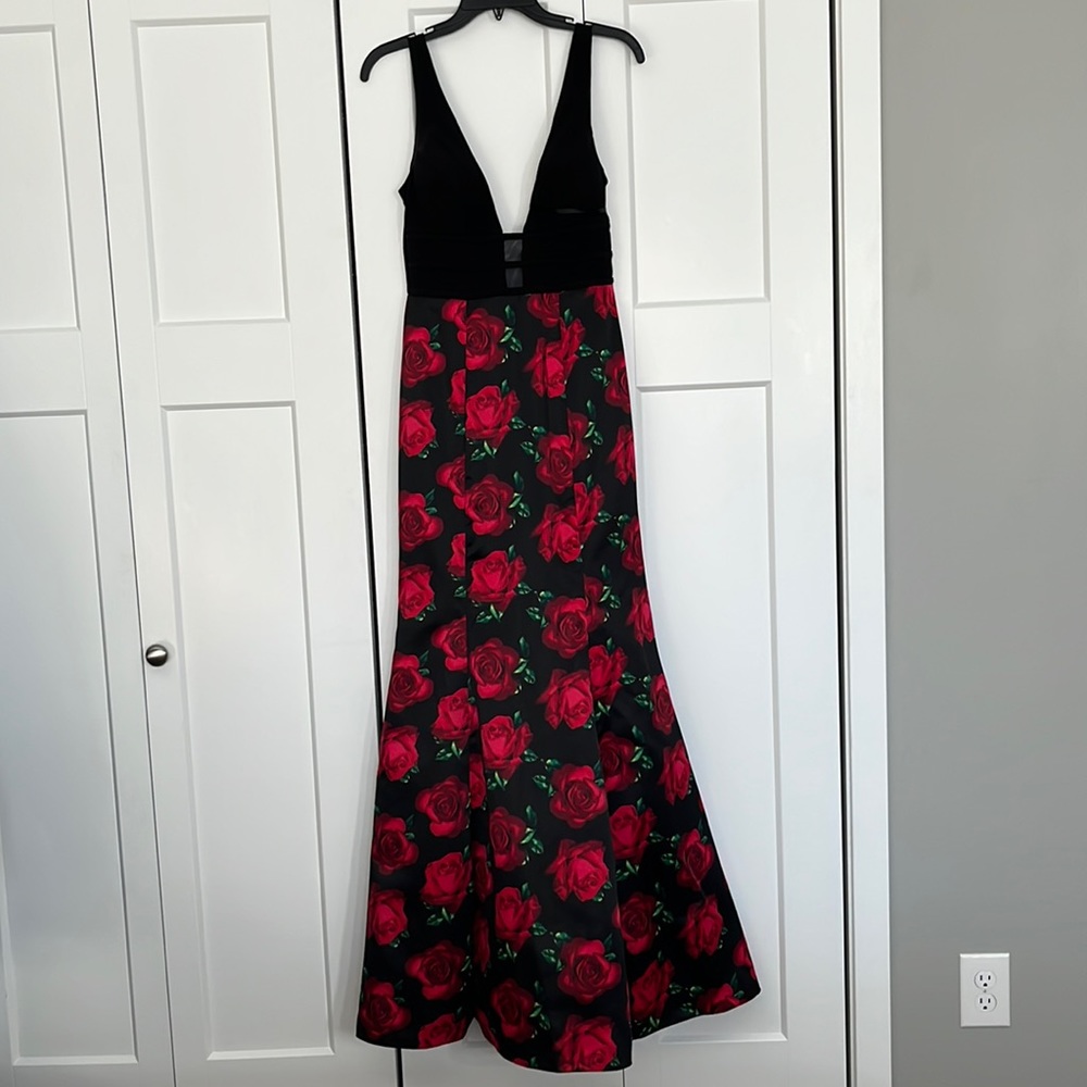 Rose themed prom dress. Tight fitted mermaid style with deep V and mesh insert